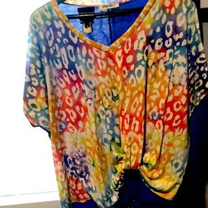 Haptics shirt large.  Purple back. Multi color front with twist in the corner.